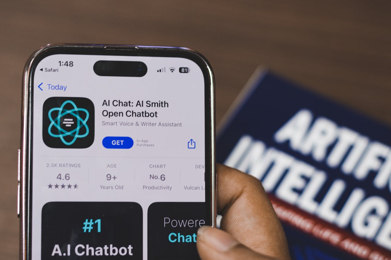 The Art of Drawing Readers In: Your attractive post title goes here Hand holding a smartphone with AI chatbot app, emphasizing artificial intelligence and technology.